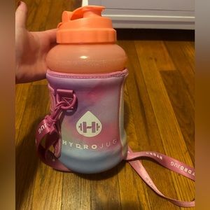 Orange hydrojug with sleeve.